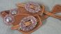 Custom spur straps light oil with pink oval buckles and conchos
